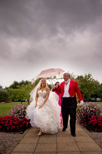 John and Evie's Wedding, arriving in the rain.